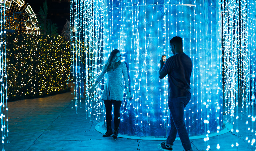 Couple in front of blue lights