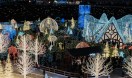 overview look at the enchant christmas village with lightened trees and roofs